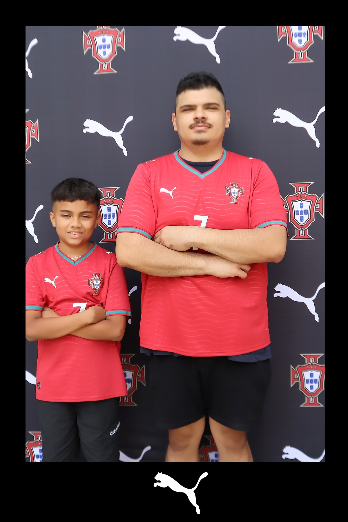 Two guests in Portugal national team jerseys at a Puma step-and-repeat