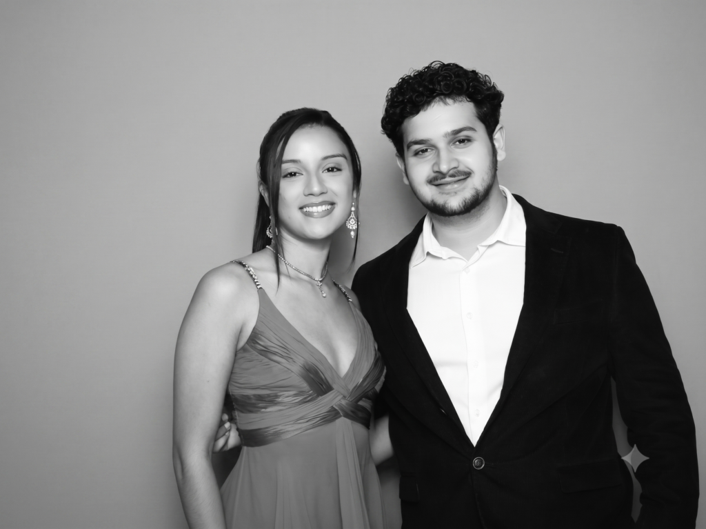 Couple posing in the glam booth