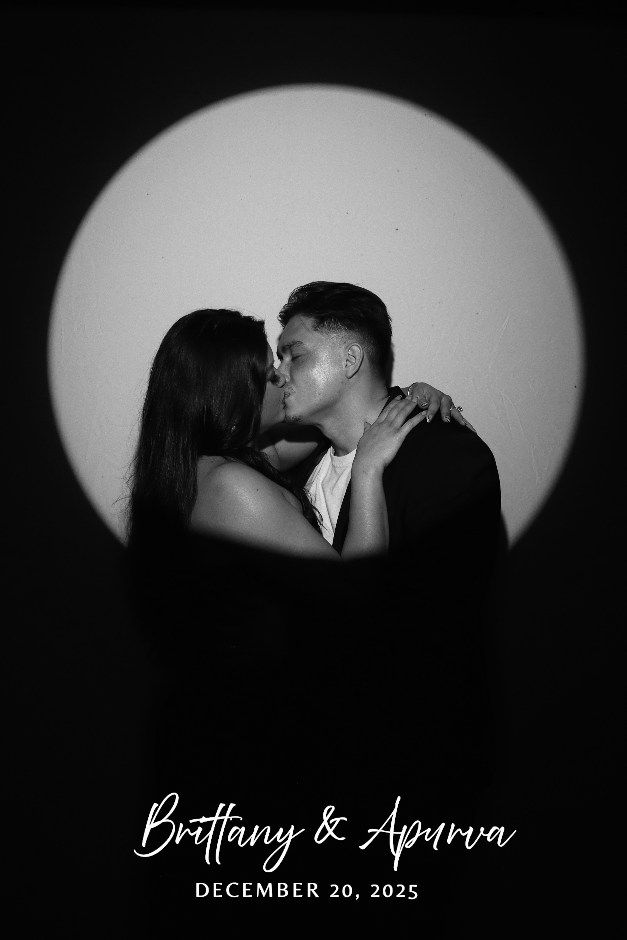 Couple in a dramatic spotlight portrait at a wedding