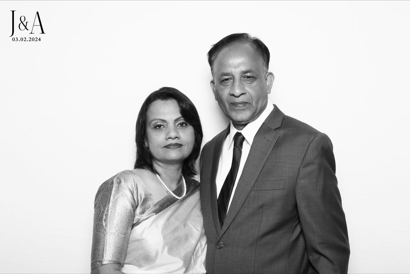 Black-and-white Glam Booth photo of a couple at a Houston wedding
