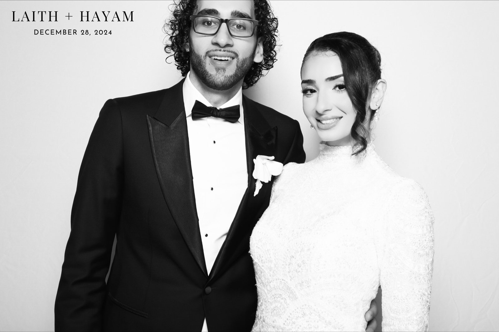 Bride and groom in the Glam Booth, black-and-white wedding photo booth in Houston